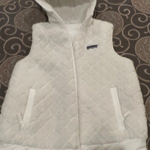 Patagonia. Vest size large. Pure white. Reversible